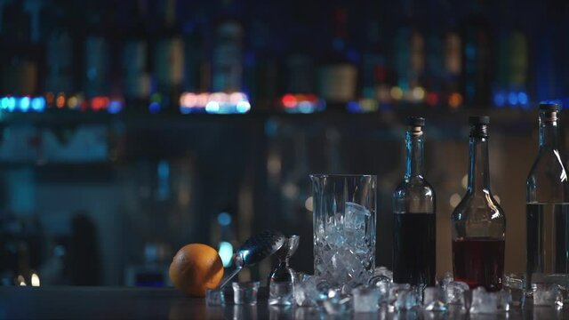 set of ingredient for negroni cocktail with ice, orange, rum, vodka and liquor