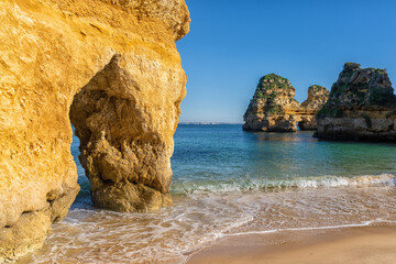 idyllic beautiful beach with rock formations and turquoise water