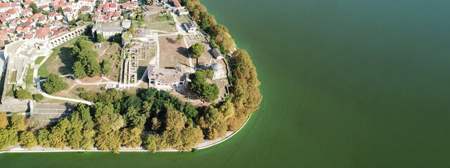 Aerial drone ultra wide panoramic photo of famous castle and mosque in lake of Ioannina, Epirus...