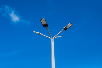 Solar cells lights against blue sky 