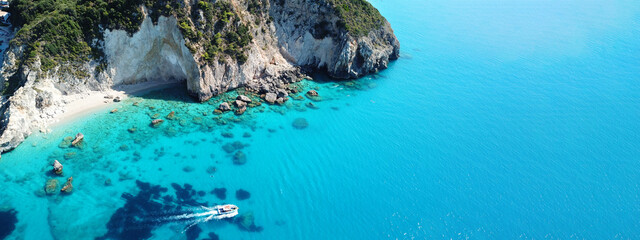 Aerial drone ultra wide panoramic photo of tropical exotic beach with deep turquoise crystal clear...