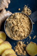 Fresh ginger root and ground ginger spice
