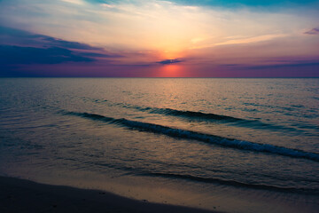 Fototapeta premium Sunset over the calm sea