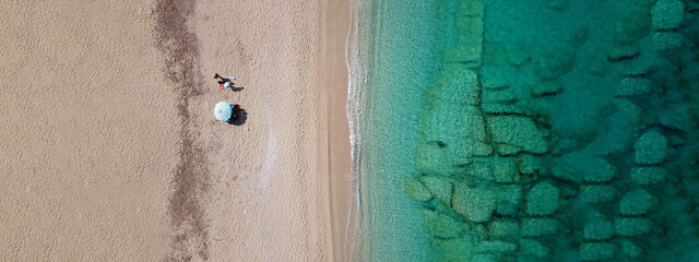 Aerial drone ultra wide panoramic photo of tropical exotic beach with deep turquoise crystal clear sea