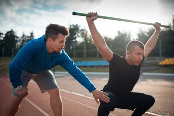  sport man has workout or exercising outdoor with personal fitness trainer © goami