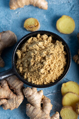 Fresh ginger root and ground ginger spice