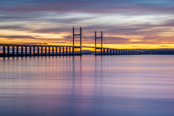 Severn Bridge crossing from England to Wales, at sunset.  The bridge is also called the Price of Wales Bridge