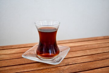 Traditional Turkish tea on wooden tabletop.