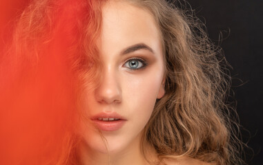Fototapeta premium Beautiful red-haired girl with beautiful makeup, with clean skin. Face close-up. Makeup concept.