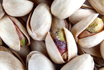 Background from pistachios. Salt pistachios in the shell.