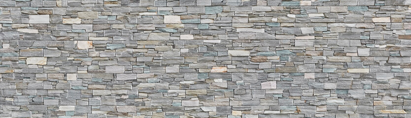 Rustic natural stone wall in panorama format