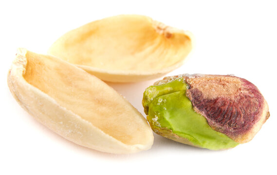 The core of pistachio and shell are isolated on a white background.