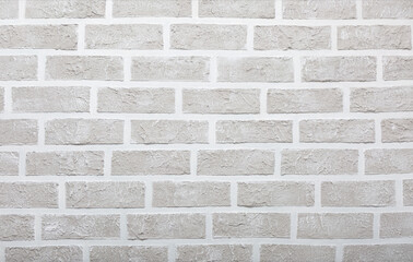 Grey brick wall imitation texture. White and beige plaster background.