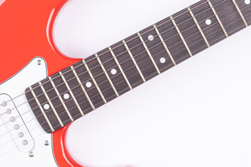Fototapeta premium Electric Guitar with red and white colors isolated above white background