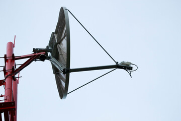 satellite dish antenna on the mast close up