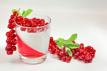 White delicious yogurt dessert with red currant berries and raspberry jelly. Healthy Breakfast, light snack. The concept of healthy eating.