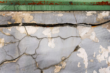 Gray wall with cracks as a wavy line. Gray wall with cracks from the shocks of solid until a wavy line