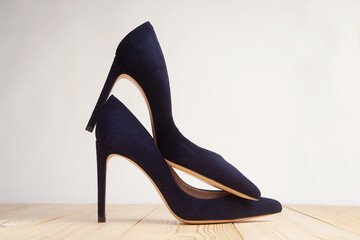 Closeup of blue high heels on white background