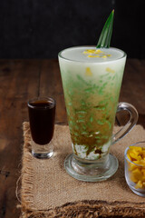 Es cendol or dawet is Indonesia traditional iced dessert made from rice flour, palm sugar, coconut milk, and pandanus leaf served in glass. Popular during fasting in Ramadan.