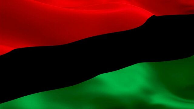 Afro-American Flag Wave Loop waving in wind. Realistic closeup Pan-African Flag background. Afro-American Flag Looping Closeup. Video of Pan-African sign waving. UNIA seamlessly looping flag. US Pan-A