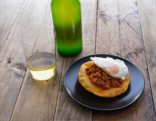 Corn pancakes with picadillo and fried egg. Copy space.