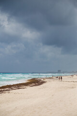 Couple walking on the beach in Cancun Mexico