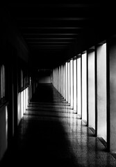 Corridor with columns in grunge tonality photo, abstract architectural photo, desaturated photo, columns, diagonal, street photography. Architectural details