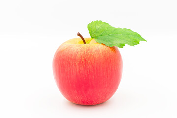 Red Apple with green leaf isolated on white background