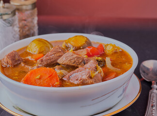 Healthy, organic, beef casserole in a white dish.