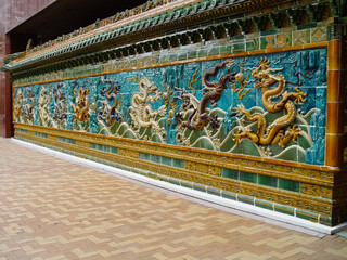 Mosaic of dragons on Chinese sarcophagus. Decorations made of tiles.