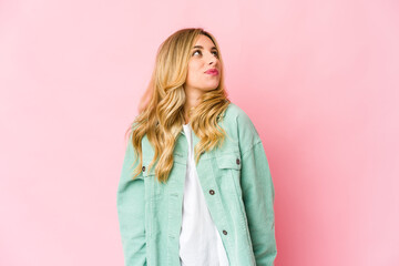 Fototapeta premium Young caucasian blonde woman dreaming of achieving goals and purposes