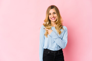 Young caucasian blonde woman showing a dislike gesture, thumbs down. Disagreement concept.