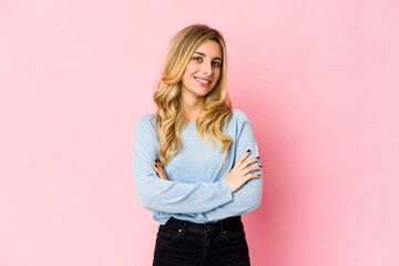 Young caucasian blonde woman upset screaming with tense hands.