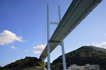 View of Megami Ohashi Bridge, Venus Wing, from Gunkanjima tour boat in Nagasaki, Japan - 長崎...