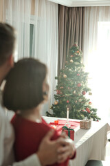 Obraz na płótnie Canvas Couple looking at beautiful Christmas tree