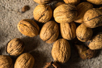 Fresh harvested wallnuts on a concrete floor