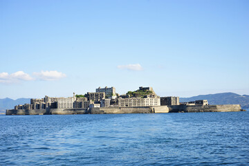 Obraz premium View of Gunkanjima or Battleship island, Ghost Island, from ferry boat in Nagasaki, Japan - 長崎 軍艦島