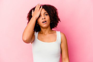 Young african american mixed race woman isolated forgetting something, slapping forehead with palm and closing eyes.