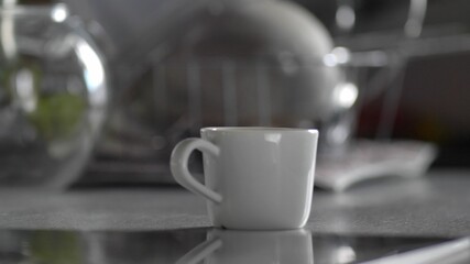Coffee Cup Spinning Around and Standing on Kitchen Table