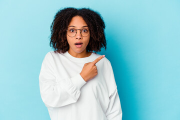 Young african american mixed race woman isolated laughing happy, carefree, natural emotion.