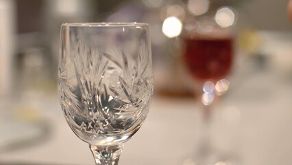 Pouring Red Alcohol Liquor Into Shot-Glass Close-Up