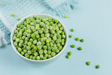 Green organic peas in bowl. Concept of homemade preparations for fast cooking. Healthy vegetarian food concept