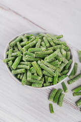 Cut green beans in bowl. Concept of homemade preparations for fast cooking. Healthy vegetarian food concept