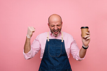 Bald mature man euphoric with happiness with coffee in recyclable cardboard cup