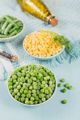 Green peas, sweet corn and cut green beans in bowl. Concept of homemade preparations for fast cooking. Healthy vegetarian food concept
