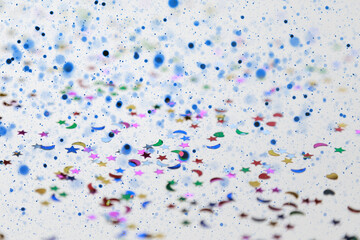 The background is a brilliant colorful multicolored 