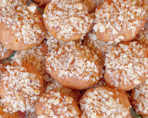 melomacarona, traditional Greek Christmas gourmet cookies with honey syrup and nuts, brown pattern background