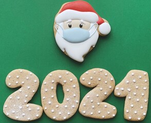 Santa Clause in a mask for 2021 new year green wallpaper 