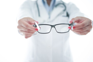 Optometrist holding a pair of glasses