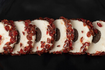 Sweet sliced dessert with dried fruit on a plate